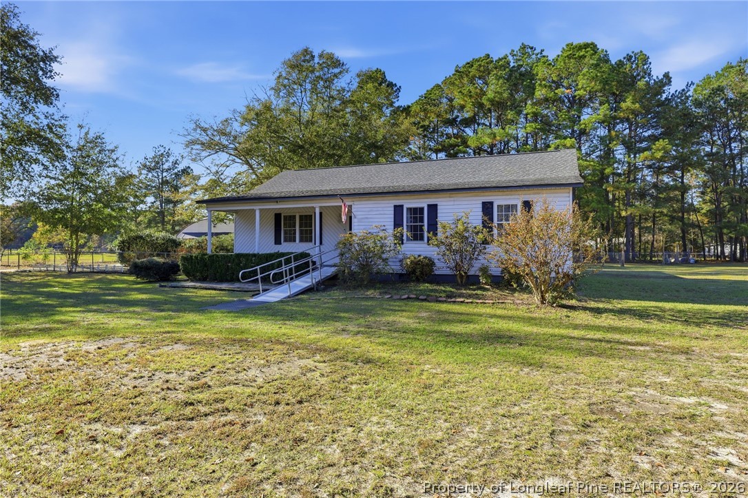 223 Broadwell Road St. Pauls, NC 28384 - Photo 2 of 28 a view of a house with a swimming pool