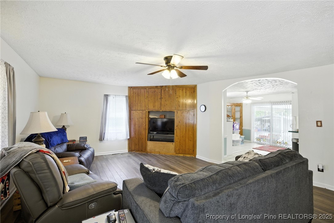 223 Broadwell Road St. Pauls, NC 28384 - Photo 22 of 28 a living room with furniture and a chandelier