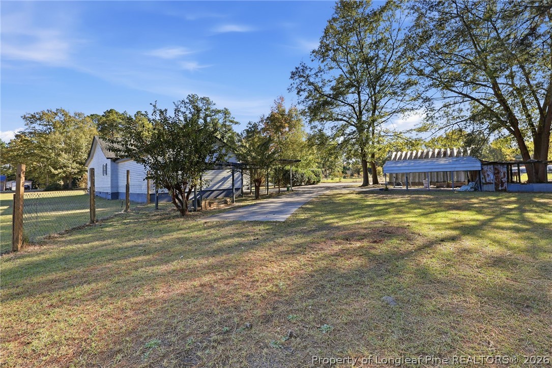 223 Broadwell Road St. Pauls, NC 28384 - Photo 26 of 28 a view of a house with a yard