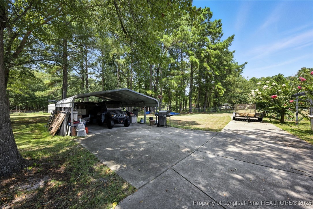 223 Broadwell Road St. Pauls, NC 28384 - Photo 26 of 28 a view of swimming pool with a patio and a yard