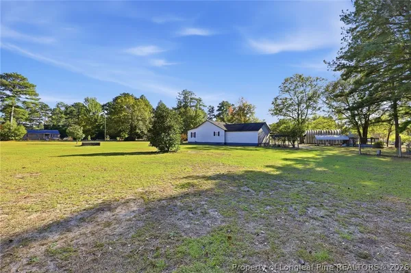 a view of a house with a big yard