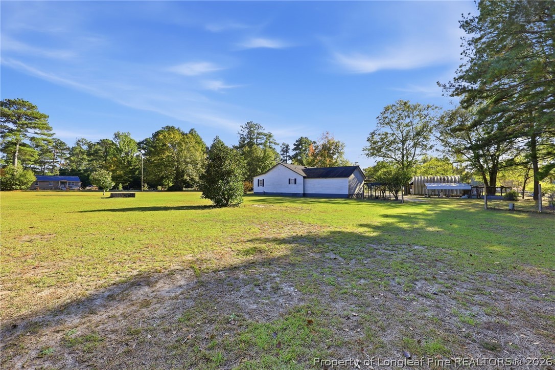 223 Broadwell Road St. Pauls, NC 28384 - Photo 27 of 28 a view of a house with a big yard