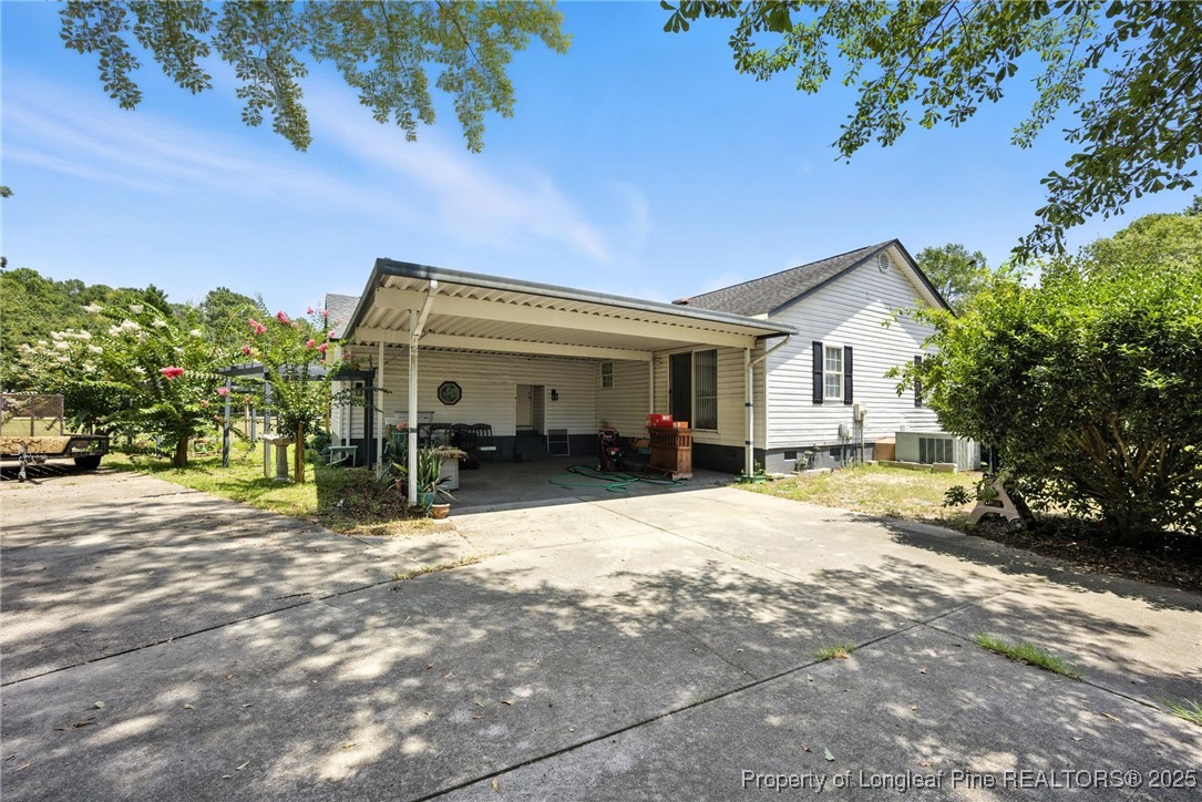 223 Broadwell Road St. Pauls, NC 28384 - Photo 27 of 28 a view of a house with a patio
