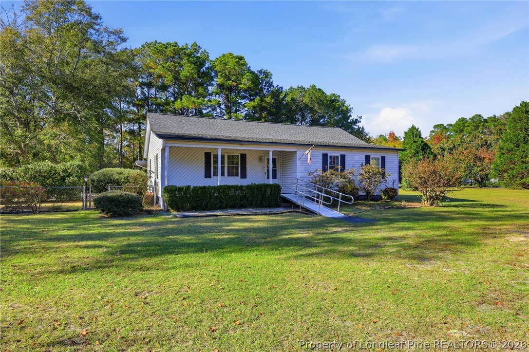 223 Broadwell Road St. Pauls, NC 28384 - Photo 3 of 28 a front view of a house with a garden