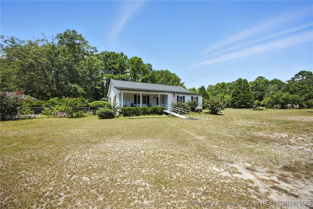 223 Broadwell Road St. Pauls, NC 28384 - Photo 4 of 28 a house view with swimming pool and garden space