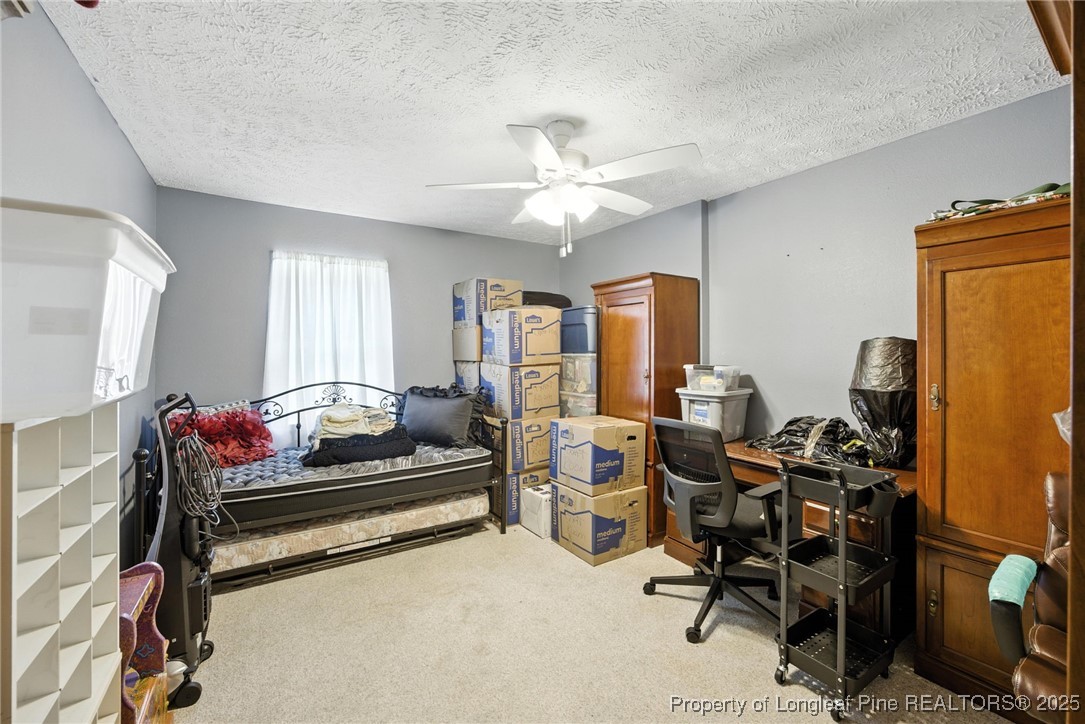 223 Broadwell Road St. Pauls, NC 28384 - Photo 6 of 28 a living room with furniture and a chandelier