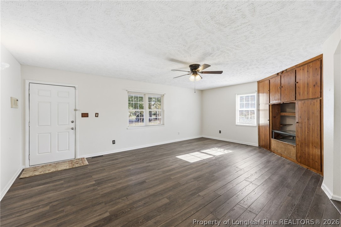 223 Broadwell Road St. Pauls, NC 28384 - Photo 6 of 28 a view of empty room with wooden floor and window