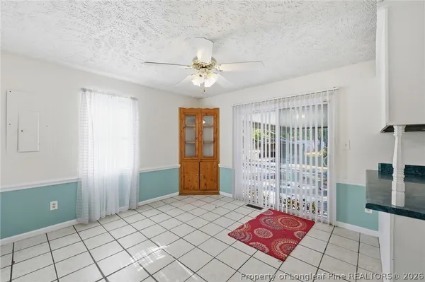 a bed room with a bed and a chandelier