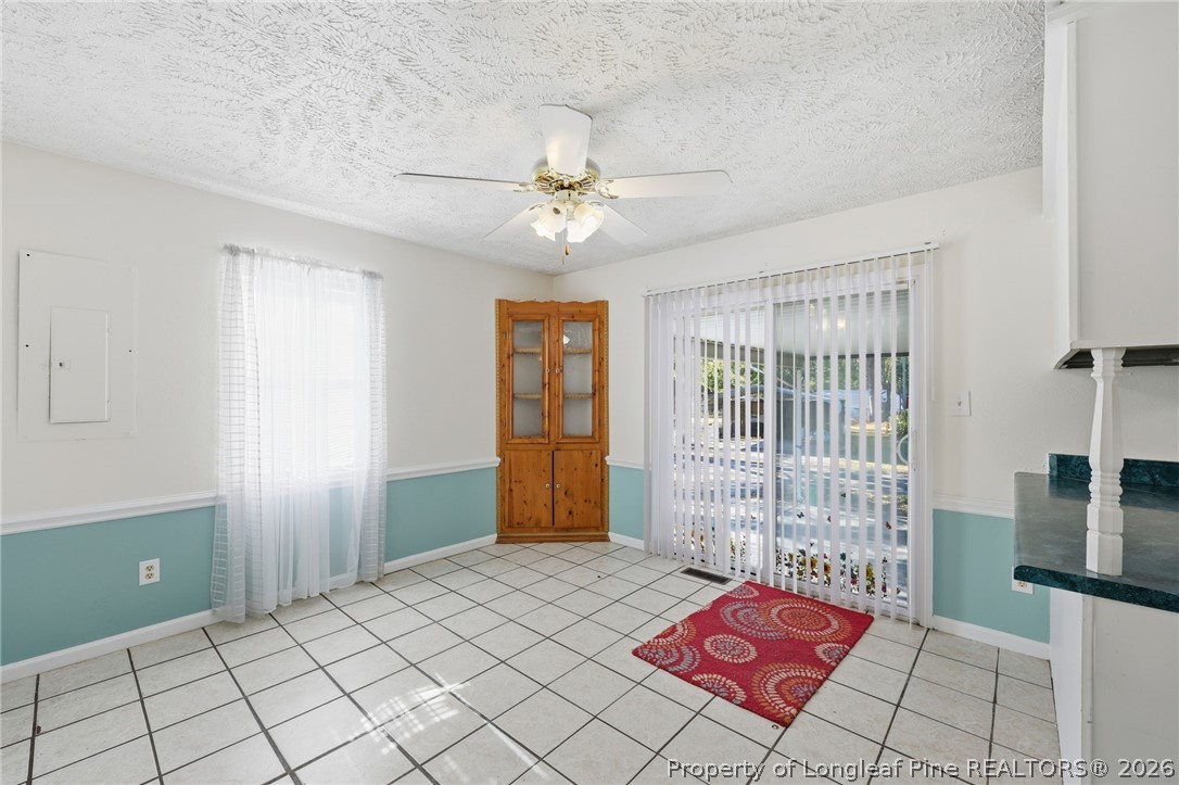223 Broadwell Road St. Pauls, NC 28384 - Photo 7 of 28 a bed room with a bed and a chandelier