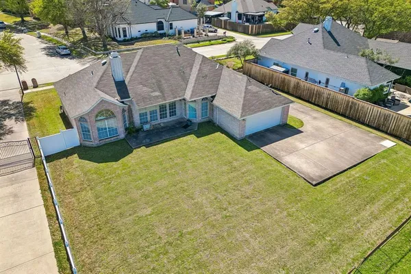 a view of a house with pool and chairs