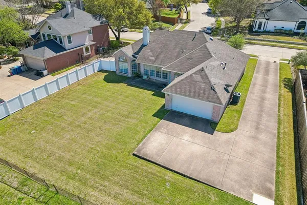 an aerial view of a house with swimming pool