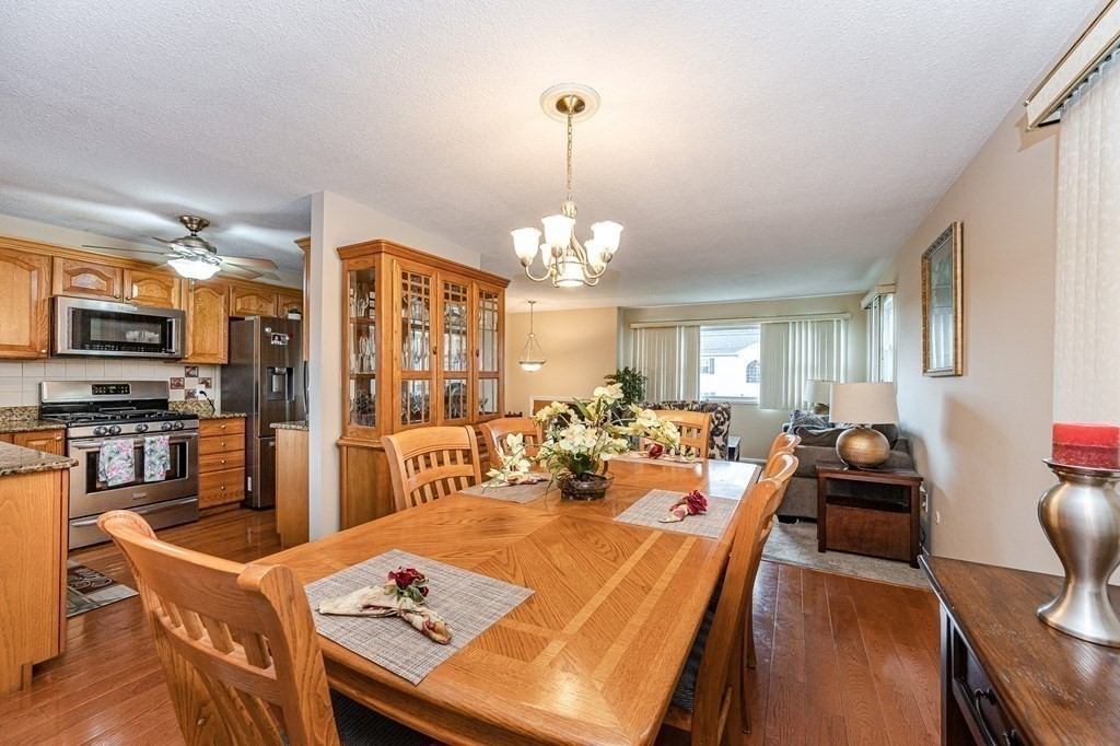 2 Lorenzo Road Lawrence, MA 01843 - Photo 11 of 42 a view of a dining room with furniture window and wooden floor