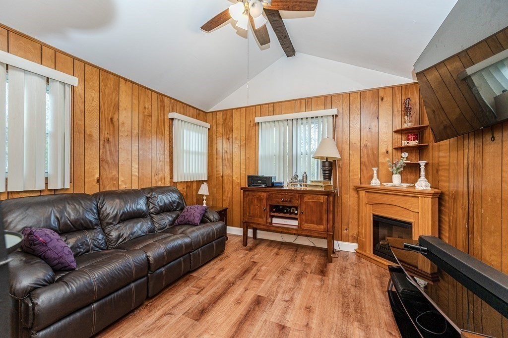 2 Lorenzo Road Lawrence, MA 01843 - Photo 12 of 42 a living room with furniture fireplace and flat screen tv
