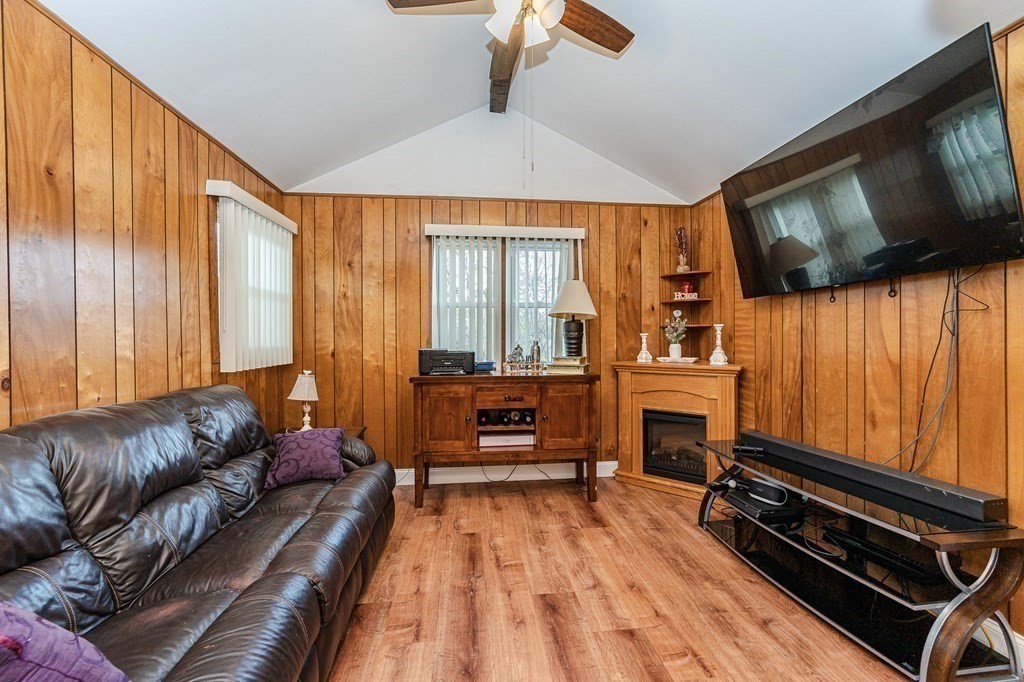 2 Lorenzo Road Lawrence, MA 01843 - Photo 13 of 42 a living room with furniture and a flat screen tv