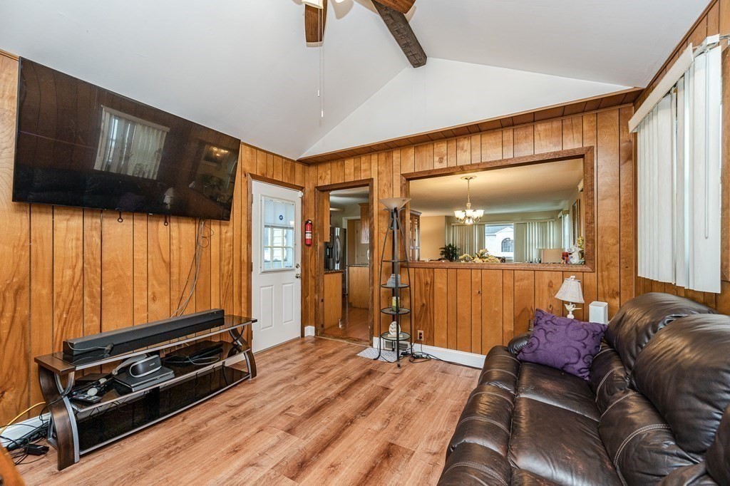 2 Lorenzo Road Lawrence, MA 01843 - Photo 14 of 42 a living room with furniture a flat screen tv and a window