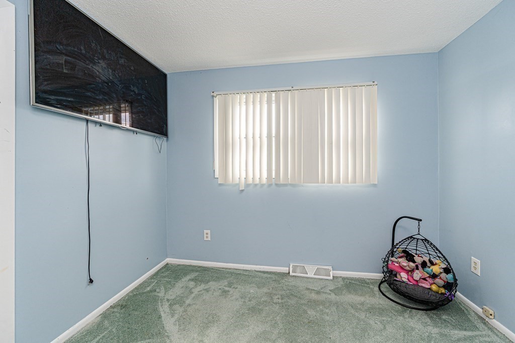 2 Lorenzo Road Lawrence, MA 01843 - Photo 19 of 42 a car parked in a room