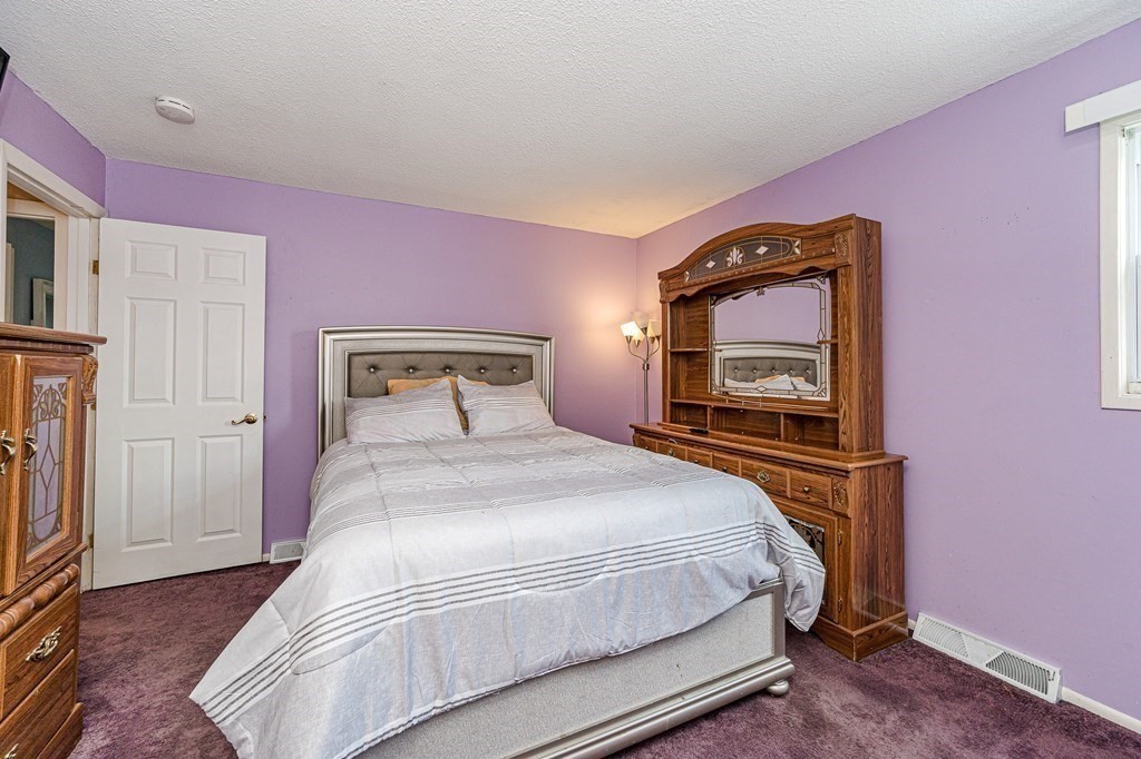 2 Lorenzo Road Lawrence, MA 01843 - Photo 21 of 42 a bedroom with a bed and a tv