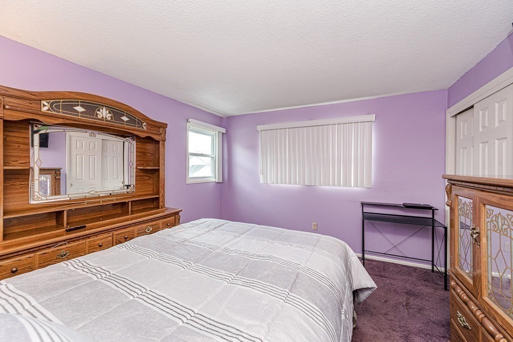 2 Lorenzo Road Lawrence, MA 01843 - Photo 23 of 42 a bedroom with a bed and a television