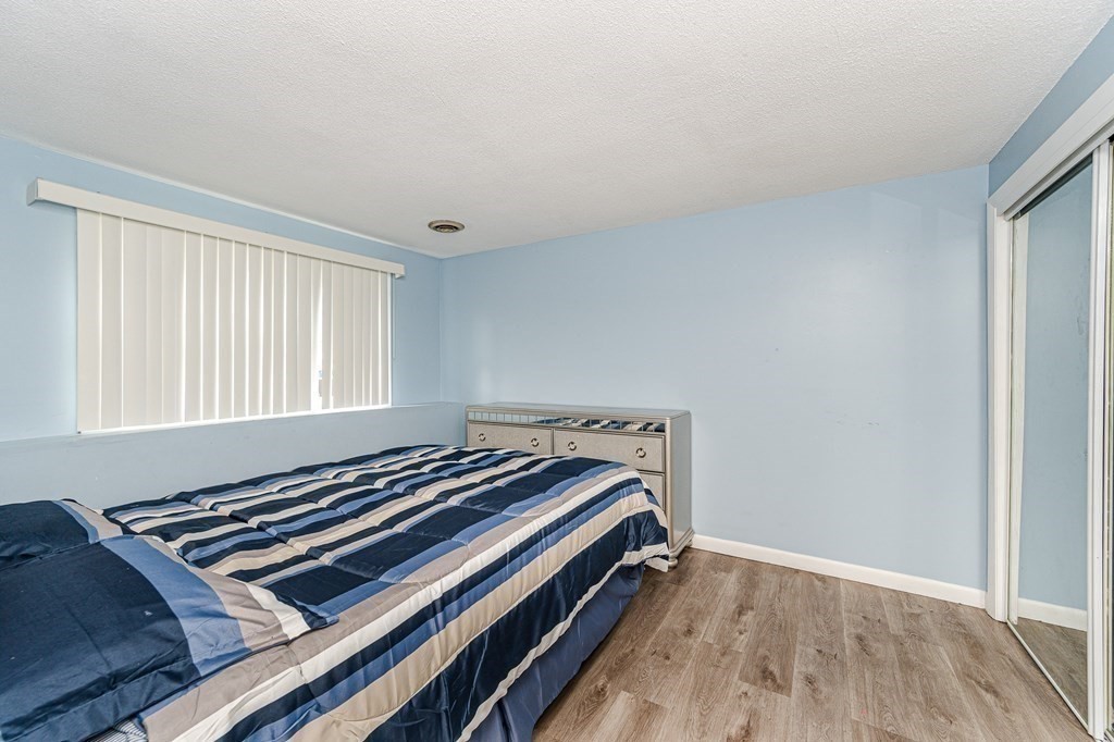 2 Lorenzo Road Lawrence, MA 01843 - Photo 27 of 42 a view of room with wooden floor and window