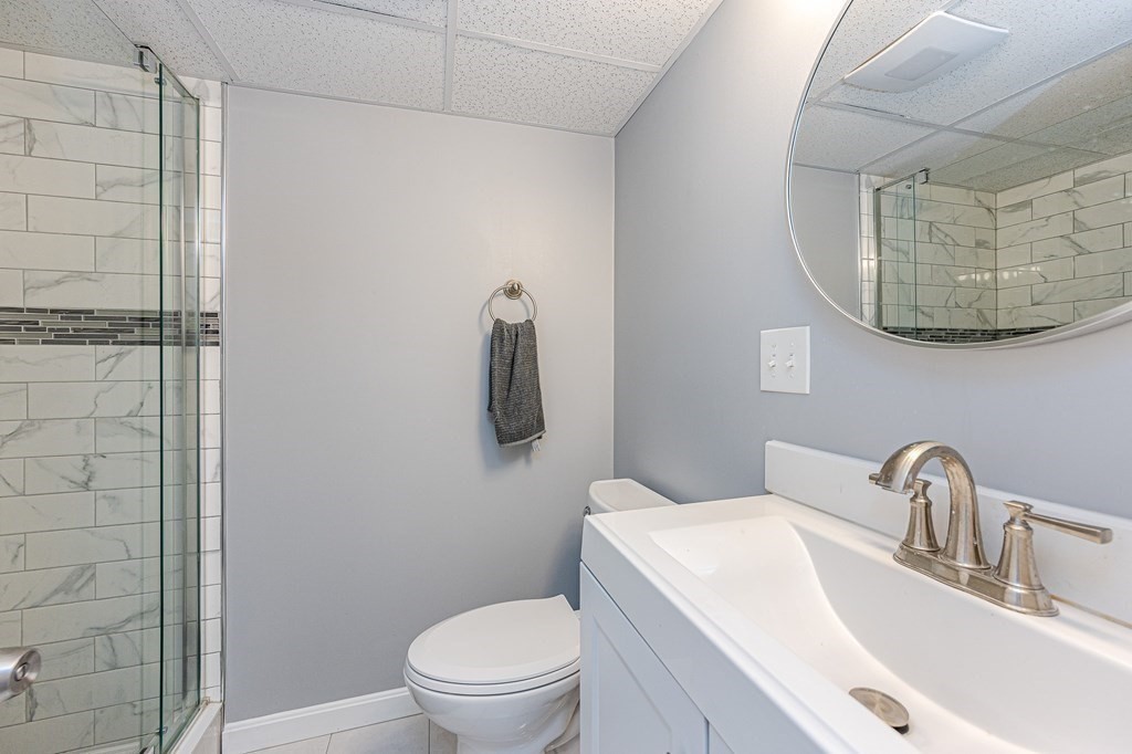 2 Lorenzo Road Lawrence, MA 01843 - Photo 28 of 42 a bathroom with a toilet a sink and mirror