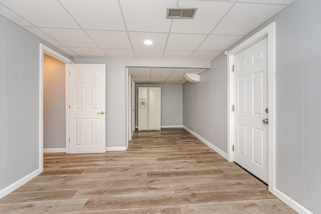 2 Lorenzo Road Lawrence, MA 01843 - Photo 32 of 42 a view of a hallway with wooden floor and staircase
