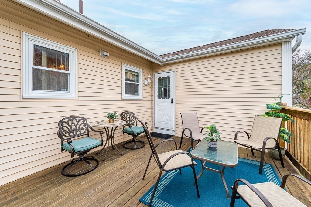 2 Lorenzo Road Lawrence, MA 01843 - Photo 37 of 42 a view of table and chair with wooden floor