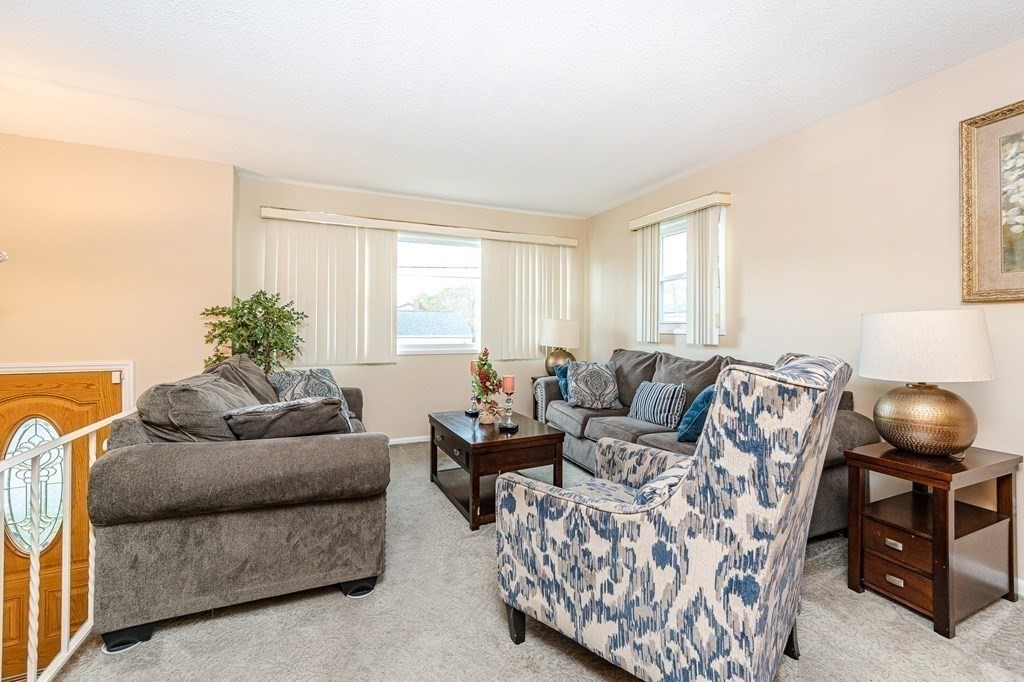 2 Lorenzo Road Lawrence, MA 01843 - Photo 5 of 42 a living room with furniture and a window