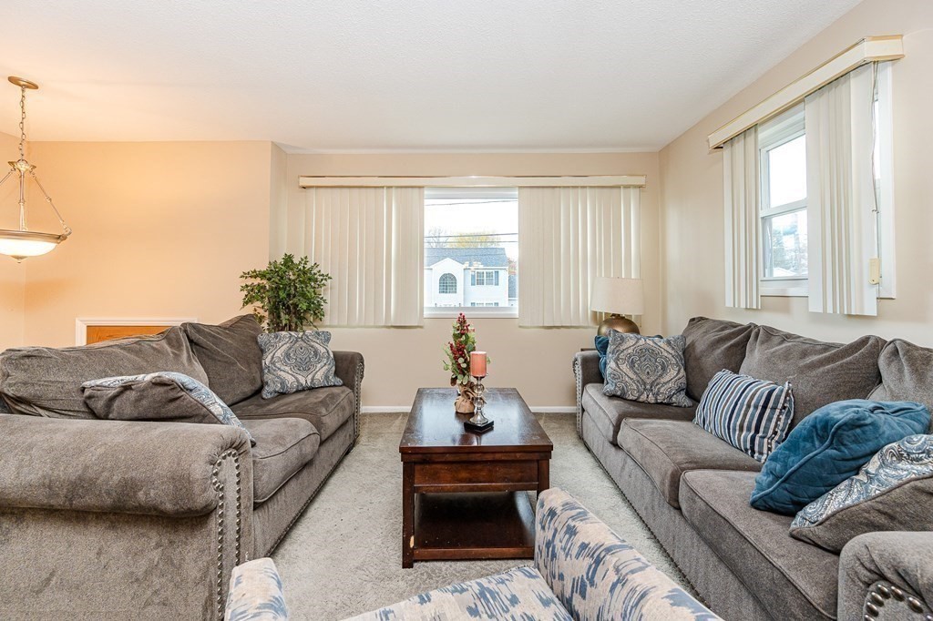 2 Lorenzo Road Lawrence, MA 01843 - Photo 6 of 42 a living room with furniture and a large window