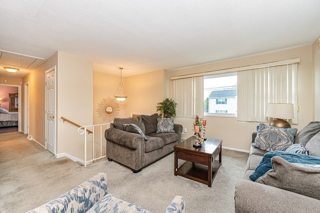 2 Lorenzo Road Lawrence, MA 01843 - Photo 7 of 42 a living room with furniture and a large window