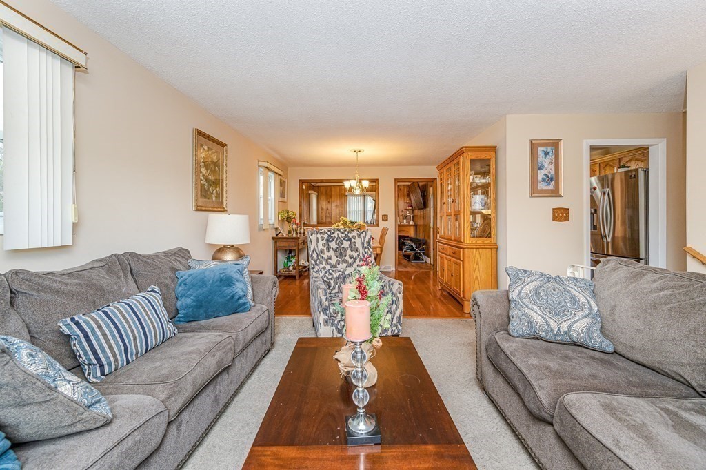 2 Lorenzo Road Lawrence, MA 01843 - Photo 8 of 42 a living room with furniture and a large window