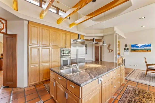 a dining room with furniture a rug and wooden floor