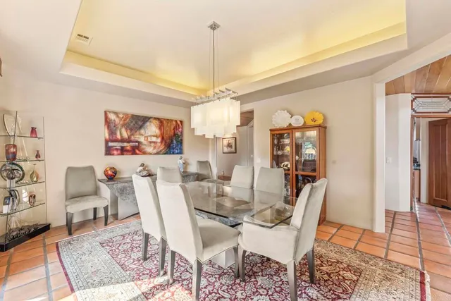 a room with furniture pool table and windows