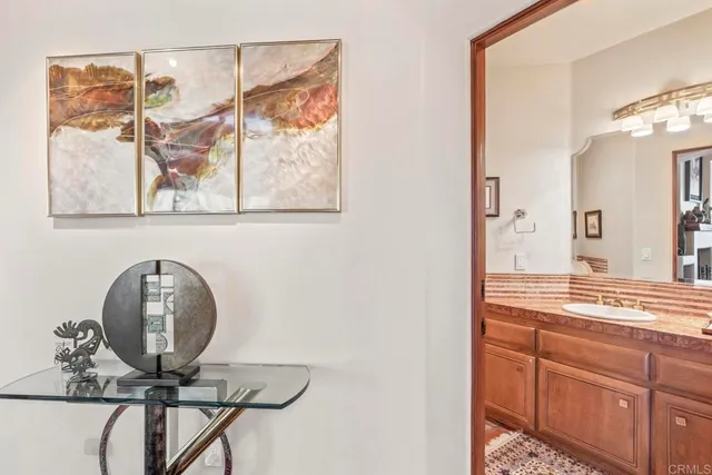 a bedroom with double bed windows and a rug