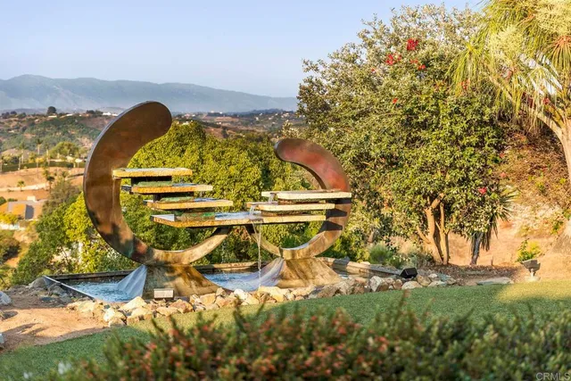 a dining room with a glass table and windows