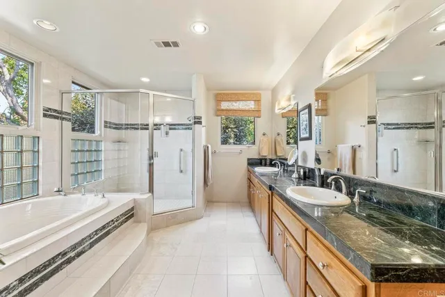 a view of swimming pool with outdoor seating and plants