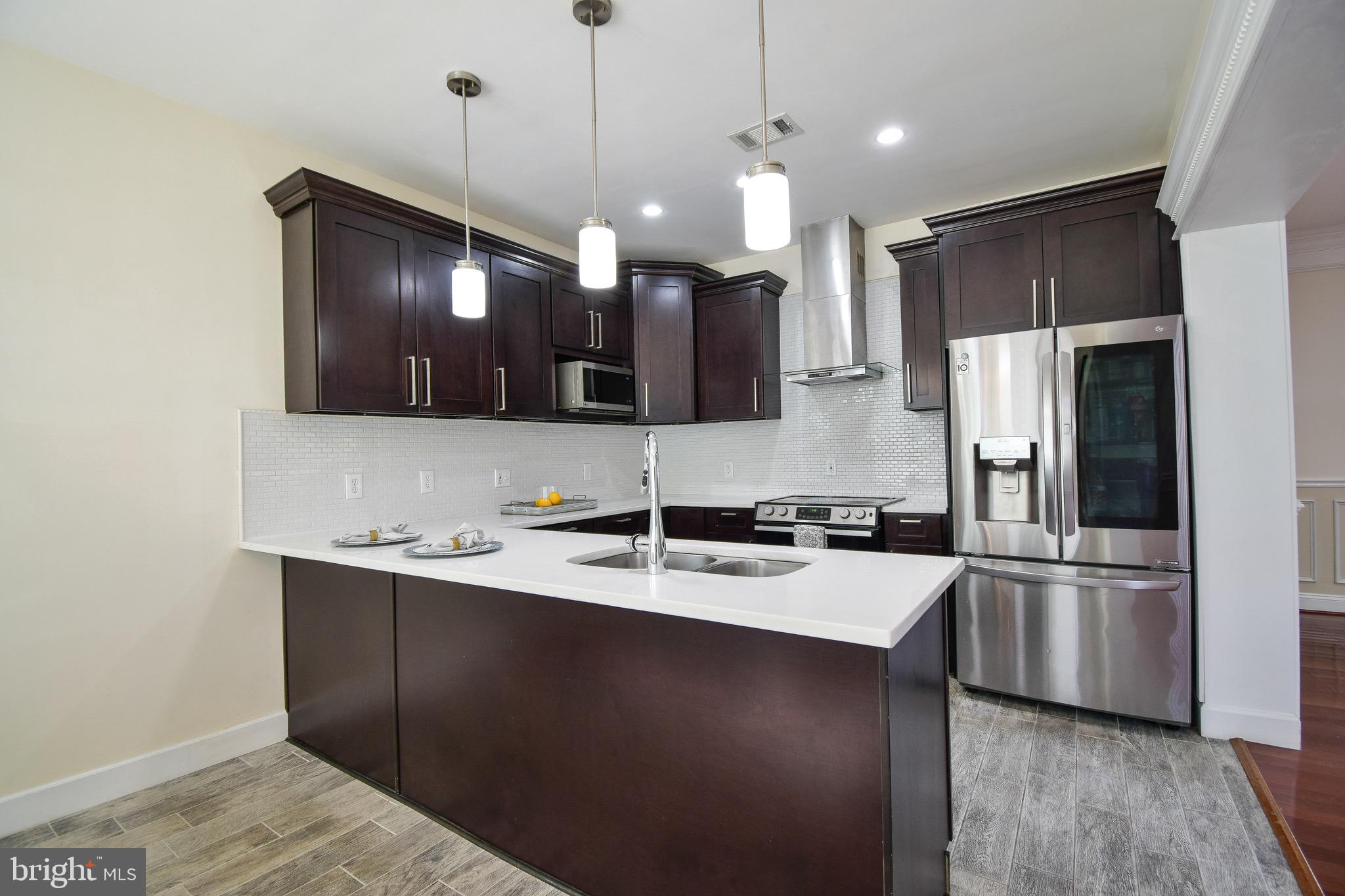 7404 Gresham Street Springfield, VA 22151 - Photo 14 of 42 uarUpdated Kitchen with Quartz Counters