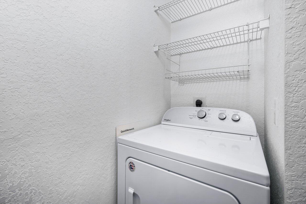 1117 Renaissance Way, Unit 117 Boynton Beach, FL 33426 - Photo 15 of 31 a utility room with dryer and washer