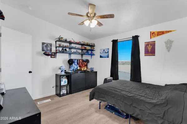 a bedroom with a bed and furniture