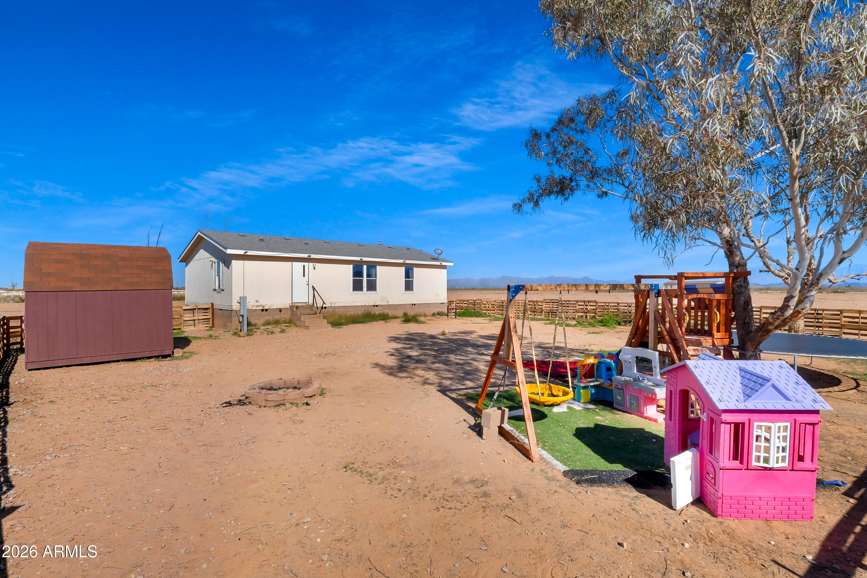 8902 Ghost Ranch Road Marana, AZ 85653 - Photo 26 of 28 a view of a house with a yard