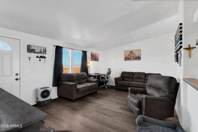 a living room with furniture and a window