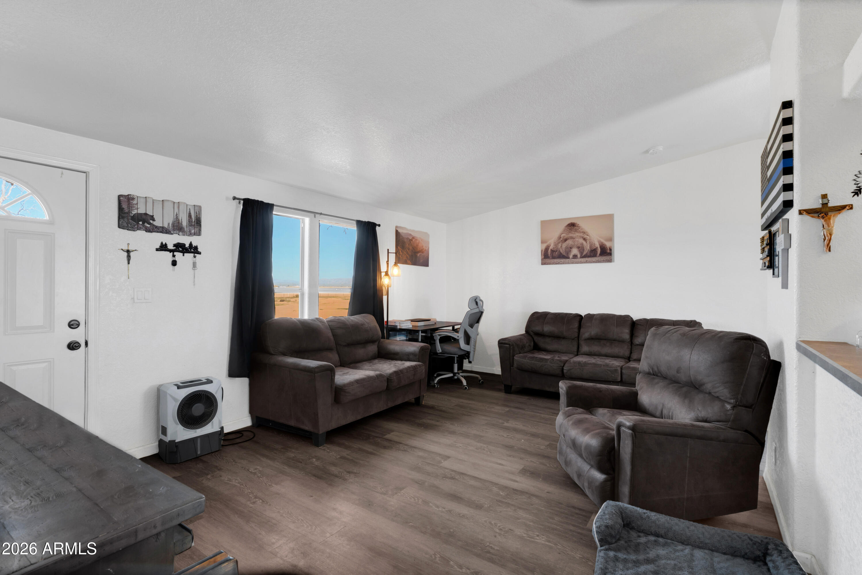 8902 Ghost Ranch Road Marana, AZ 85653 - Photo 4 of 28 a living room with furniture and a window