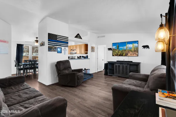 a living room with furniture fireplace and a flat screen tv