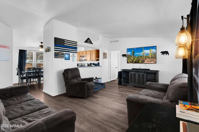 a living room with furniture fireplace and a flat screen tv