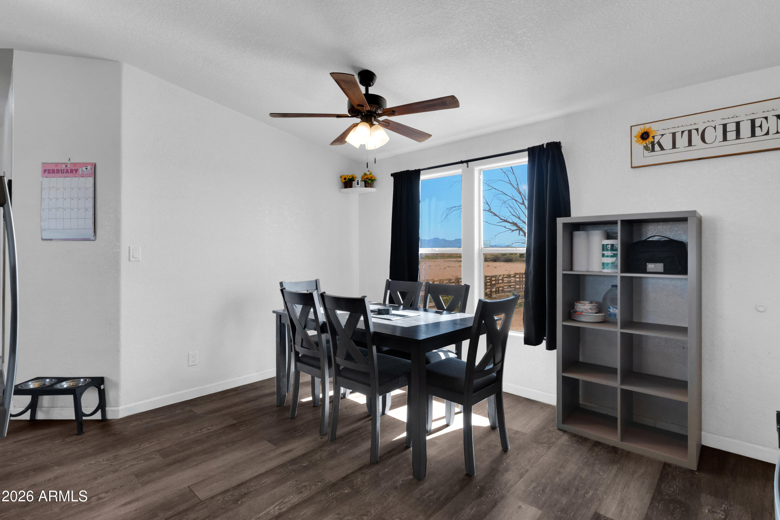8902 Ghost Ranch Road Marana, AZ 85653 - Photo 8 of 28 a dining room with furniture window and wooden floor