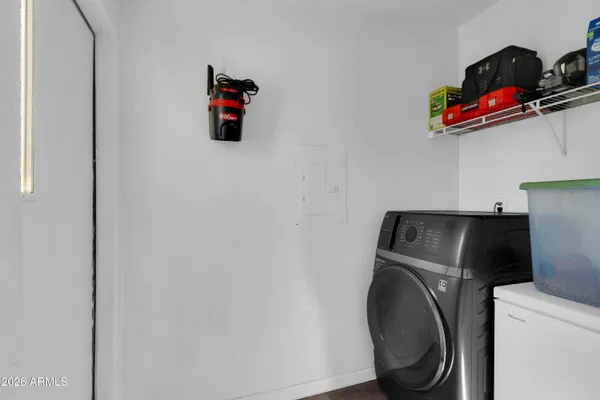 a utility room with dryer and washer