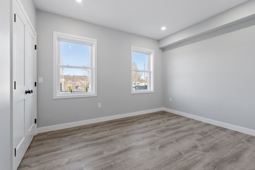 631 Franklin Street, Unit 106 Worcester, MA 01604 - Photo 14 of 36 a view of empty room with wooden floor