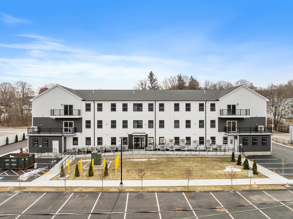 631 Franklin Street, Unit 106 Worcester, MA 01604 - Photo 2 of 36 a view of swimming pool with outdoor seating and yard