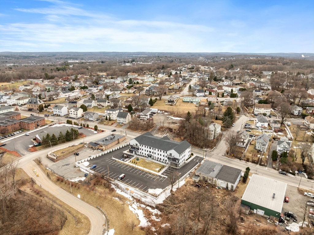 631 Franklin Street, Unit 106 Worcester, MA 01604 - Photo 35 of 36 an aerial view of residential building with yard