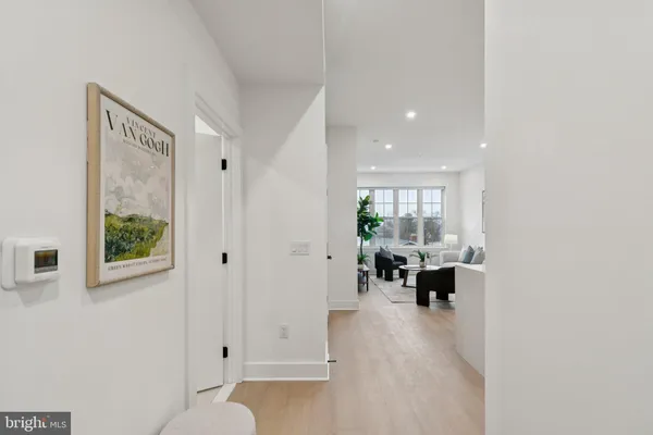 a view of living room with furniture and floor to ceiling window