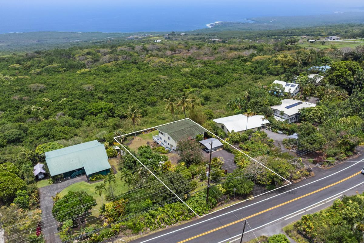 85-4563 Hawaii Belt Road Captain Cook, HI 96704 - Photo 2 of 30 an aerial view of a house with a yard